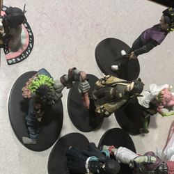 Demon Slayer Figures And A Robin One Piece Figure