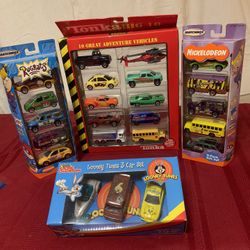4 Sets Of Assorted Cars.