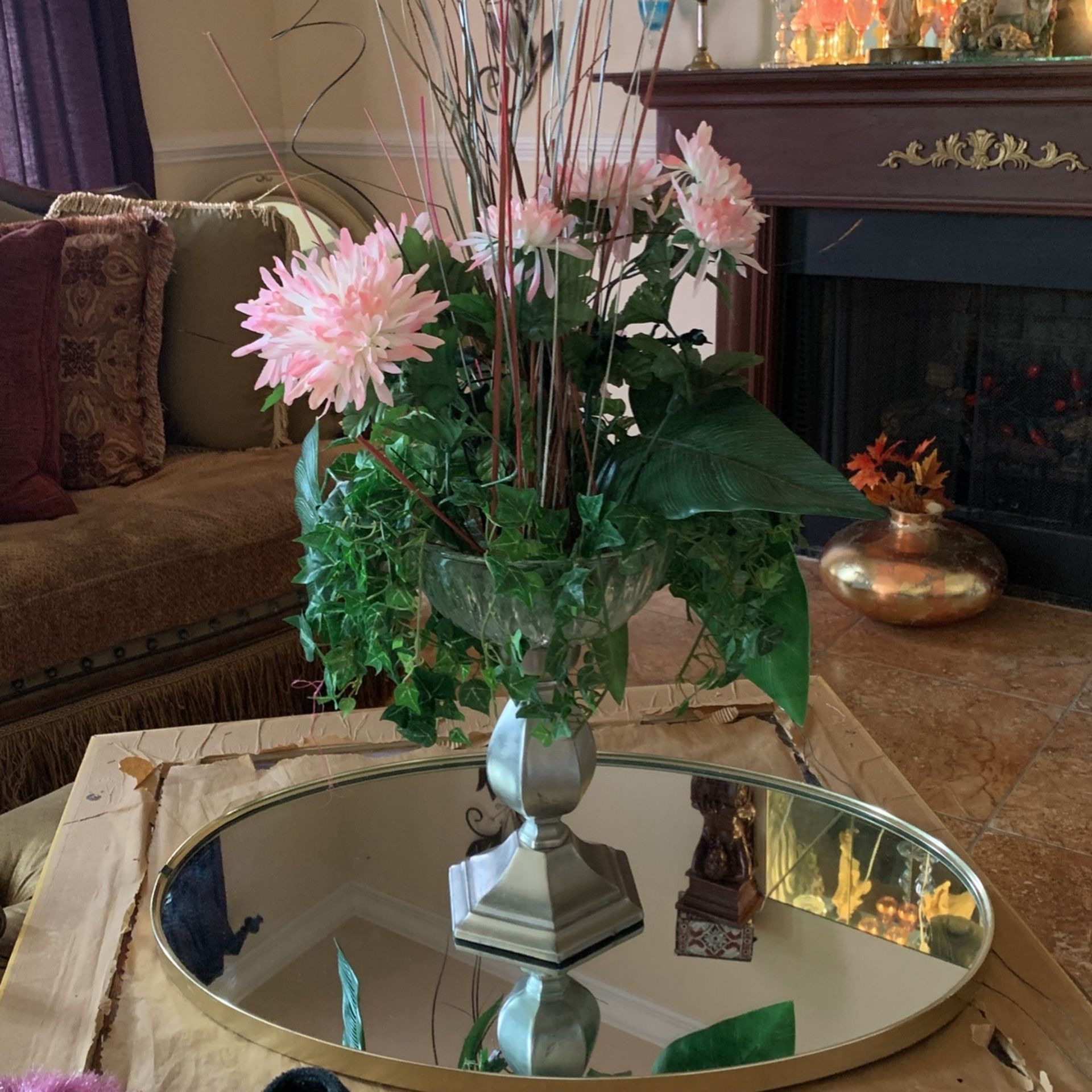 Floral arrangement and pewter in crystal ball