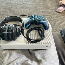 X Box With Controller Wires And Headphones
