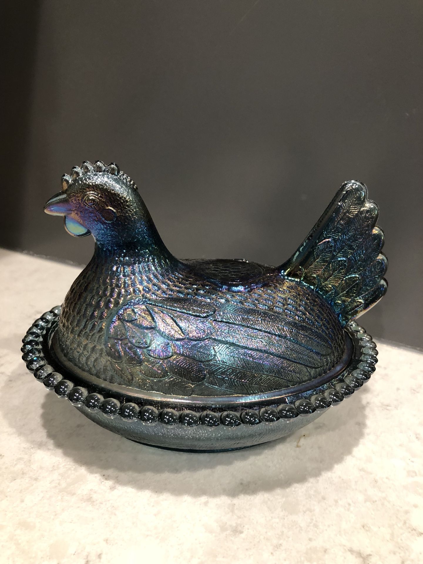Vintage Indiana Blue Iridescent Carnival Glass Chicken on a nest. Has a small chip on inside rim
