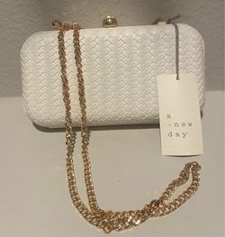 New (with tags) Off white Hard Case Clutch Purse with golden closure and shoulder drape chain.