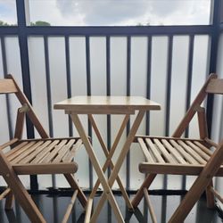 Two wooden chairs and a wooden table
