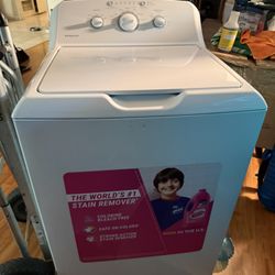 The Hotpoint  3.8 cu. ft. capacity top-load washer featuring a stainless steel basket, heavy-duty agitator, 700 RPM spin speed .New never used.