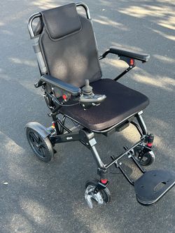 Brand new lightweight electric, Wheel Chair graphite worth $1000