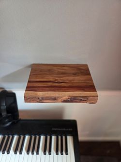 Canary wood live edge floating shelf.