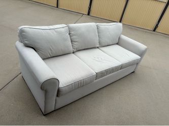 Beige couch with pullout bed