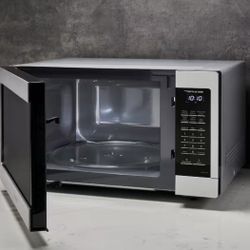 (New In Box )1.6 cu. ft. Countertop Microwave in Stainless Steel with Inverter Technology and Genius Sensor Cooking