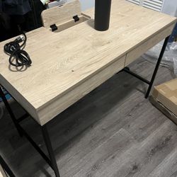wood desk with drawers and charging station