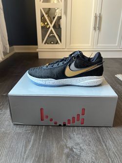 Nike LeBron XX in black, metallic gold, white, and neon.