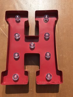 Metal letter H lights up