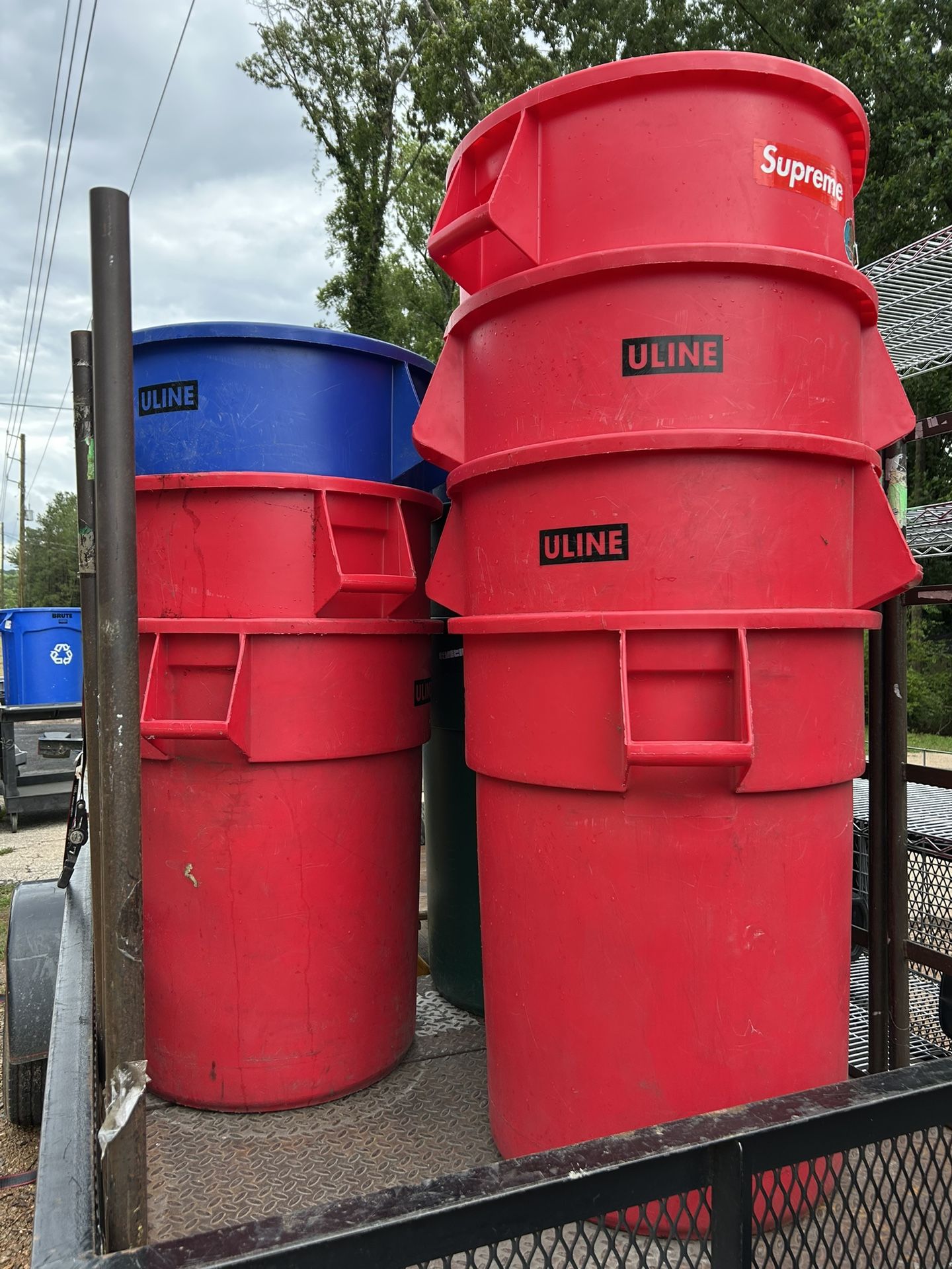 Ten 55 Gallon Trash cans