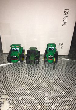 Three brand new John Deere tractors