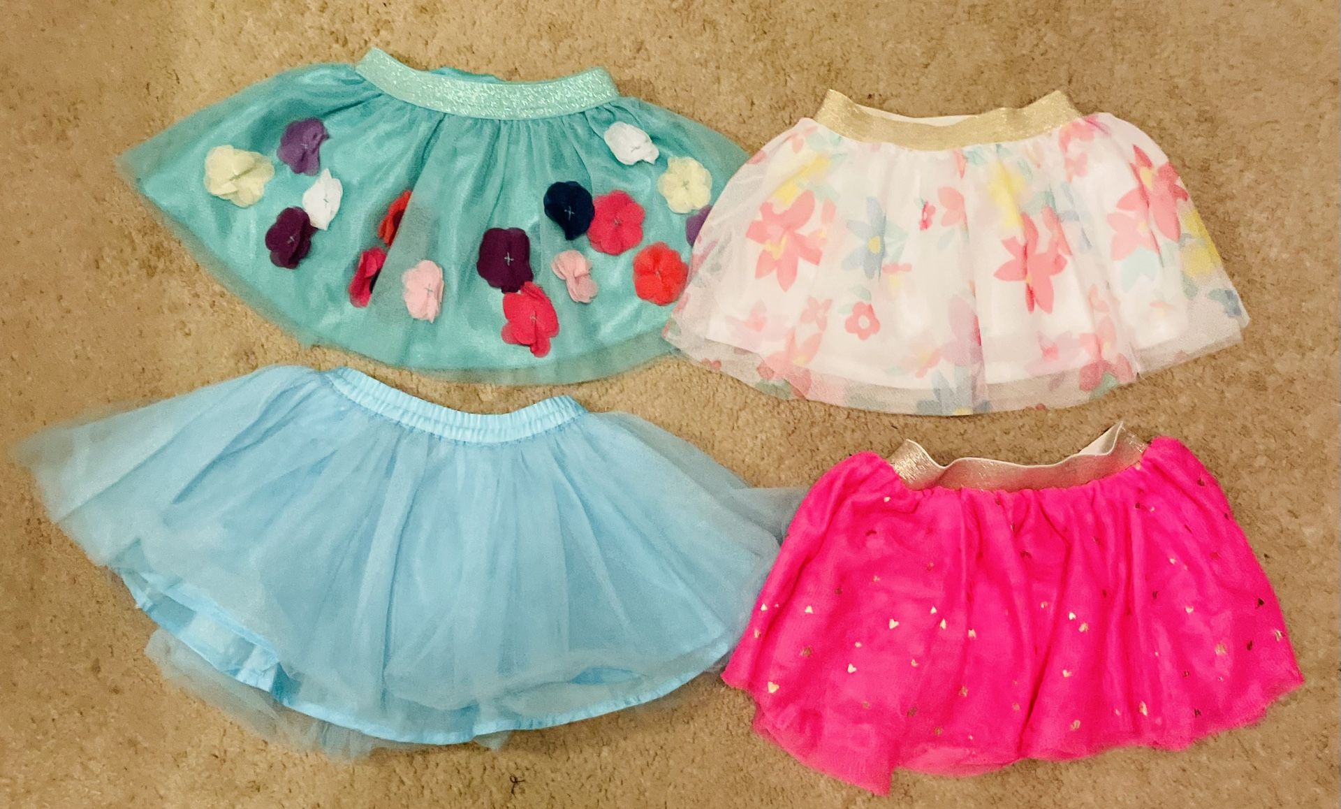 Four Pack Girl’s 12-18M Short & Flowy Skirts; Blue Floral, White Floral, Blue, & Pink w/ Gold Hearts
