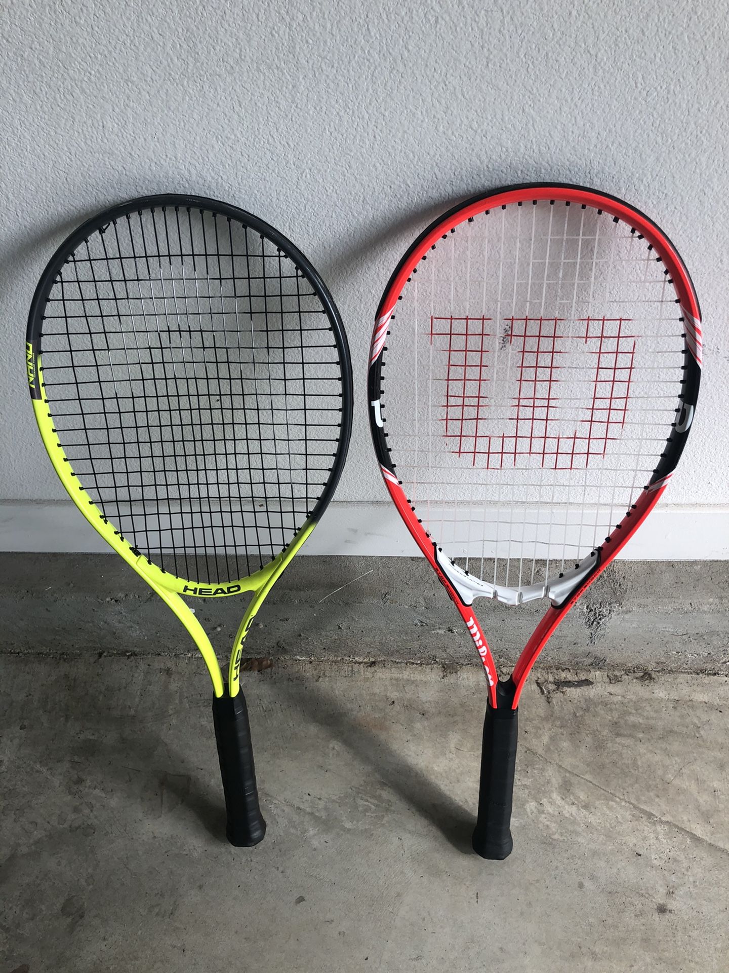 Two adult tennis rackets