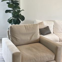 Beige swivel chair and one piece of Edgewater couch seat