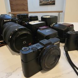 Sony Cameras And Lenses  Bundle A99, RX 100ii And More G Lens