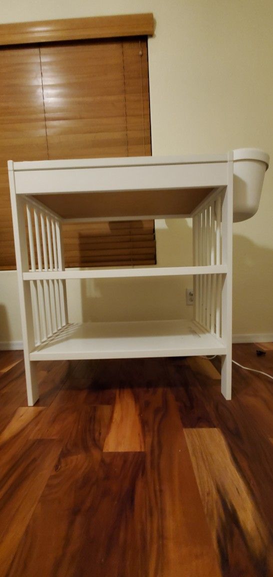 Diaper changing table with pad, cover and rack