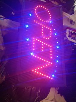 OPEN sign with hanging chain