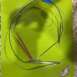 Four Circular Fixed Metal Needles Of Various Lengths And Sizes