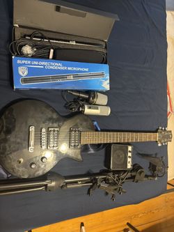 Microphones, Electric Guitar, A Mini 3 Speaker, Amplifier, And Mike Stanwood, Microphone Mount And Tablet Holder.