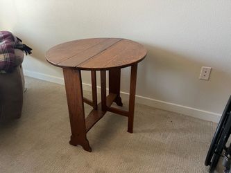 Round end table with folding sides