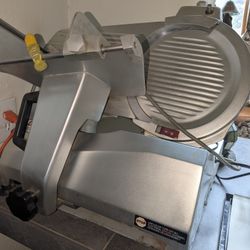 Univex Model 7512 food slicer. It is a medium-duty, manual gravity 12" Blade