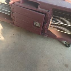 Used for holding and transporting hot or cold food pans to maintain safe serving temperatures.