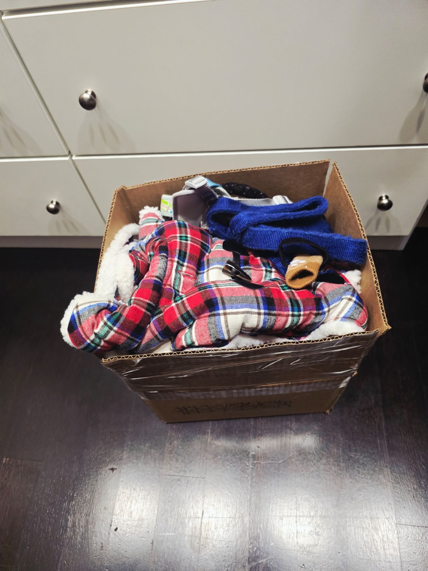 Box full of small ans Xsmall dog clothes
