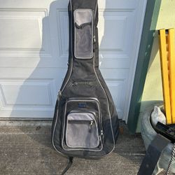 Acoustic guitar pad a gig bag in good shape. Has backpack straps and all the zippers work just fine.   $40, cash or Venmo, meet in person somewhere co