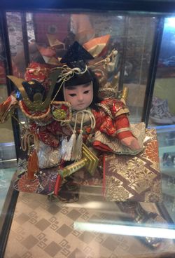 Japonese doll in a glass case