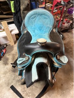 Saddle with extra equipment