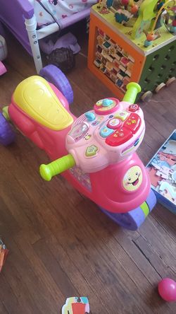Vtech ride and learn bike lights up and has activites and games