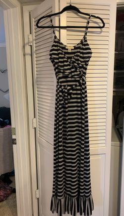 Very cute long summer dress size medium has adjustable straps and a self belt