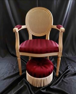 Louis XVI style medallion-back armchair and matching tufted footstool. Excellent