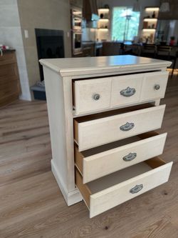 White Wood 4-Drawer Dresser with Ornate Pulls
