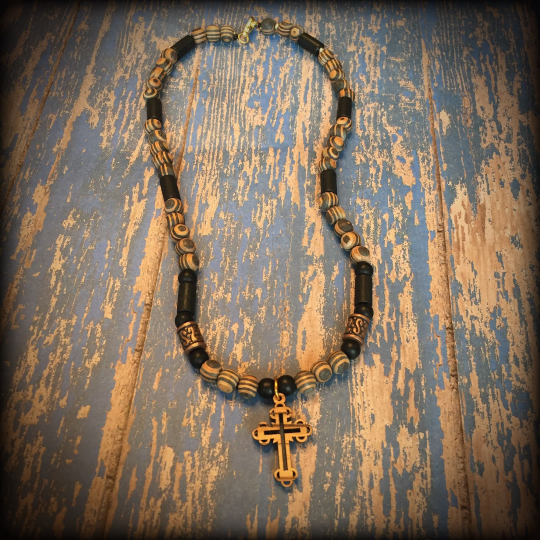 ** Men’s striped amber wood beads necklace with Holy Land cross.