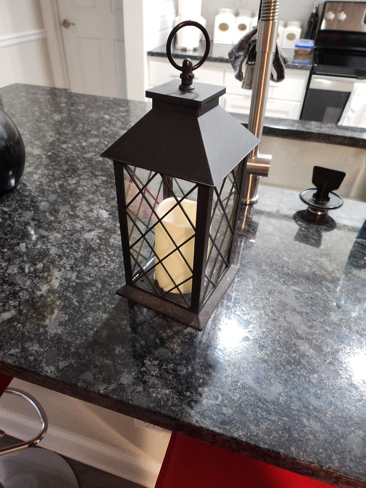 Candle light and holder cage