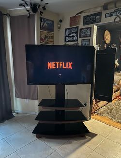 Emerson 55in TV with shelved tv stand . Not a smart TV