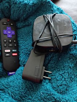 Roku box, board games and lava lamp