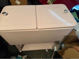 Pink cooler with wheels. Can opener connected on the side. Have two. Can be sold separately