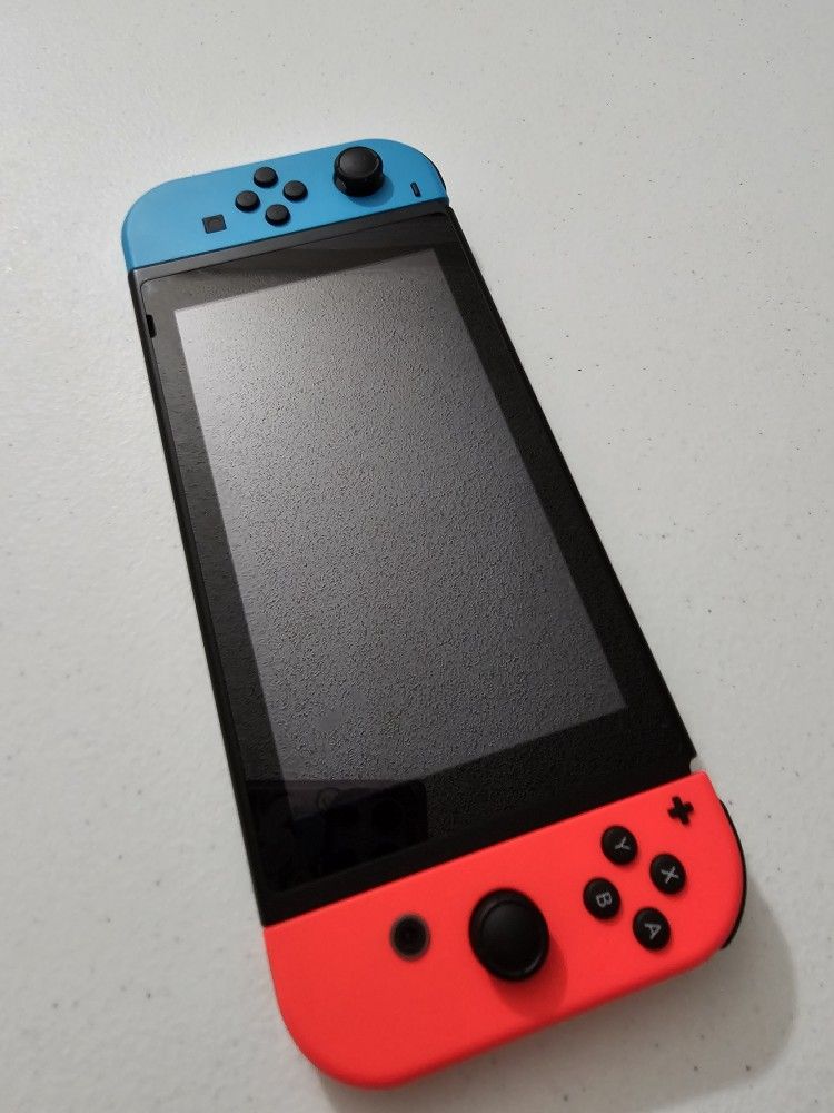 Nintendo Switch with Neon Blue and Neon Red Joy Con Bundle
