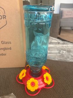 vintage-style blue embossed glass hummingbird feeder