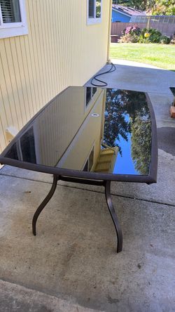 Patio table with glass top