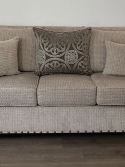 Beige Fabric Sofa and love seat with Nailhead Trim