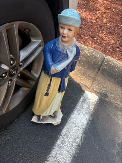 porcelain statue of a woman standing broken base