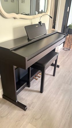 Selling a Yamaha Arius YDP-105 digital piano in excellent condition.