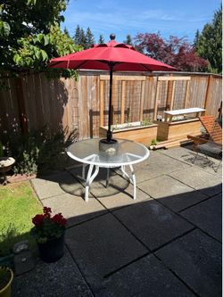 Metal and Glass Patio Table and Umbrella
