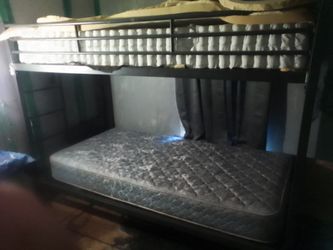 Metal frame bunk bed folds up easy to tare down and to put together not that old  $100.00