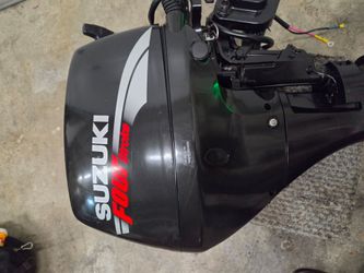 Low hours 15 HP Suzuki Outboard long shaft boat engine